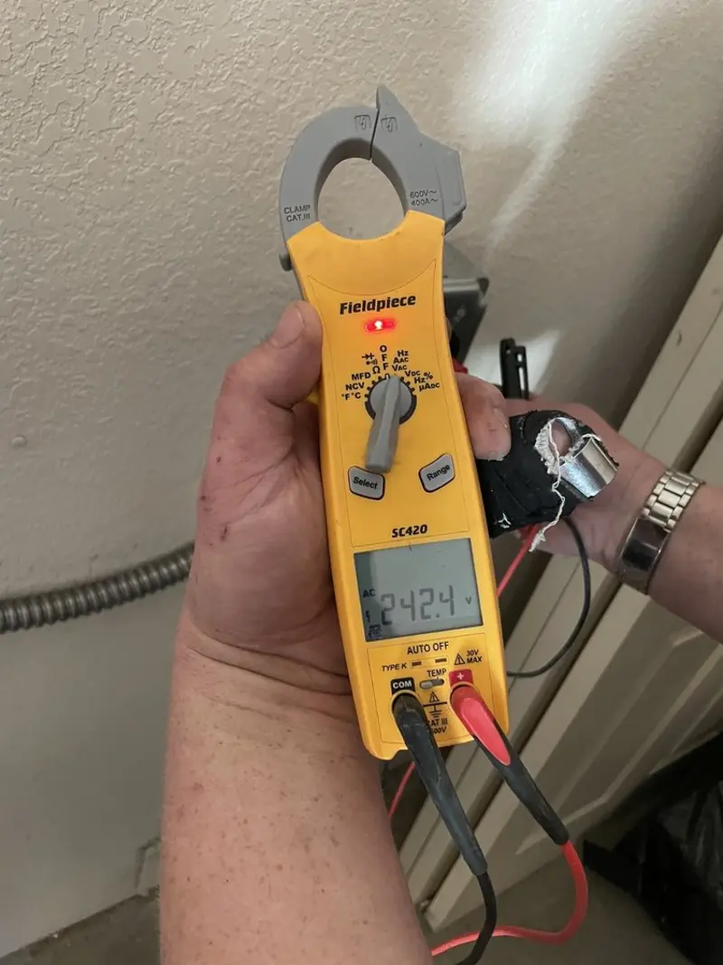 Voltage testing with clamp meter during Electrical Installation Services in Oak Grove